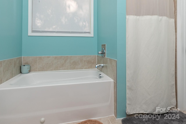 bathroom featuring a bathtub and tile patterned flooring