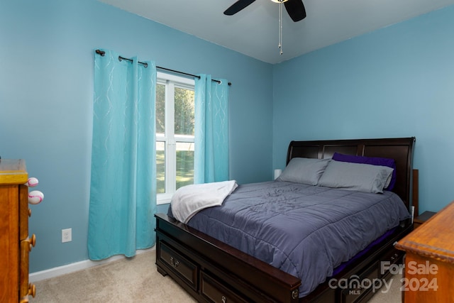 bedroom featuring light carpet and ceiling fan