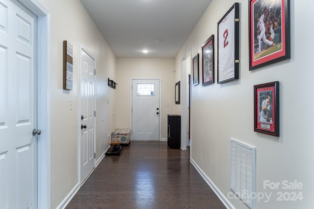 hallway featuring dark wood-type flooring