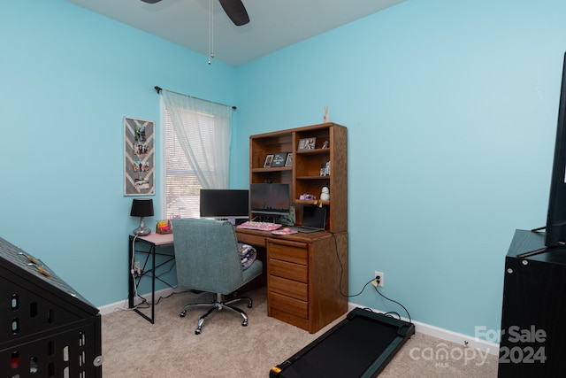 office featuring light carpet and ceiling fan