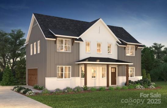 view of front of house featuring board and batten siding, concrete driveway, and an attached garage