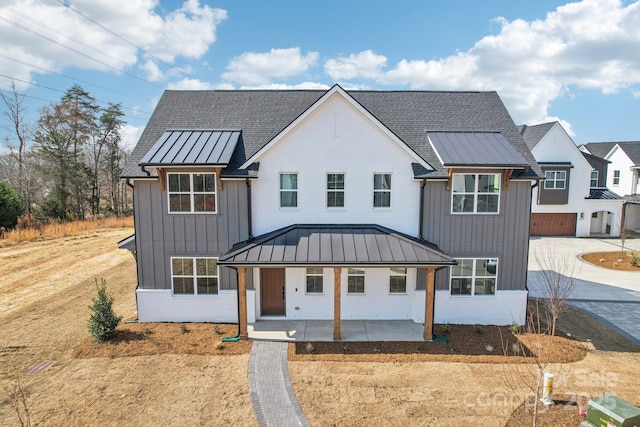 809 Terra Dr, Tega Cay, SC 29708 - modern inspired farmhouse with metal roof, board and batten siding, concrete driveway, and a standing seam roof