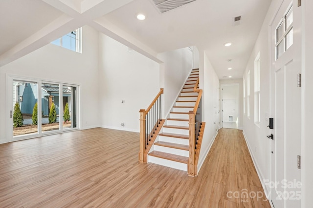 809 Terra Dr, Tega Cay, SC 29708 - foyer entrance featuring stairs, a wealth of natural light, visible vents, and light wood finished floors