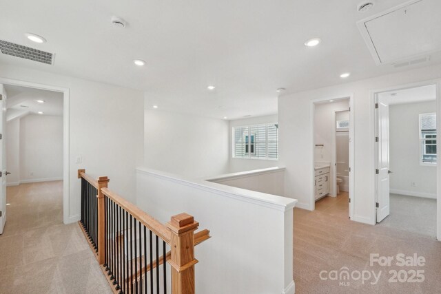 809 Terra Dr, Tega Cay, SC 29708 - hall featuring visible vents, light colored carpet, attic access, an upstairs landing, and recessed lighting