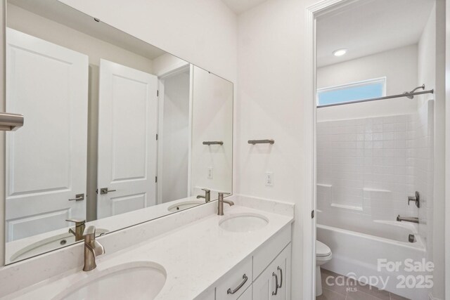 809 Terra Dr, Tega Cay, SC 29708 - bathroom featuring double vanity, toilet, and a sink