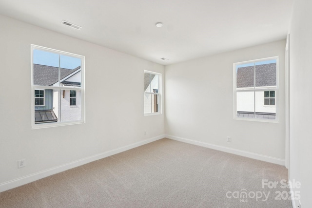 809 Terra Dr, Tega Cay, SC 29708 - spare room with carpet, visible vents, and a healthy amount of sunlight