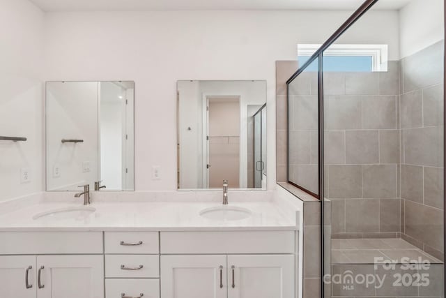 809 Terra Dr, Tega Cay, SC 29708 - bathroom with double vanity, a shower stall, and a sink