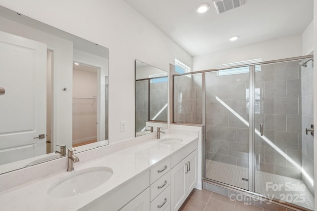 809 Terra Dr, Tega Cay, SC 29708 - full bath with a sink, visible vents, a shower stall, and tile patterned flooring