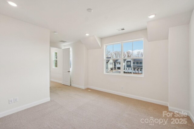 809 Terra Dr, Tega Cay, SC 29708 - empty room featuring recessed lighting, visible vents, carpet flooring, and baseboards