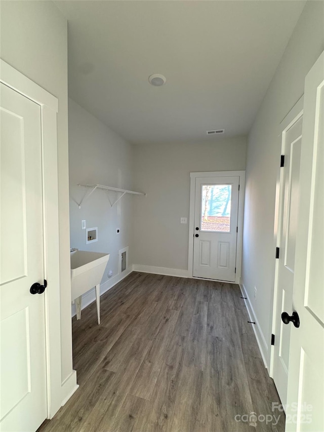 laundry area with washer hookup, hardwood / wood-style flooring, hookup for an electric dryer, and gas dryer hookup