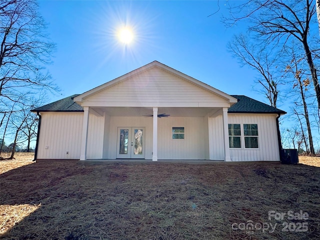 rear view of house featuring ceiling fan and french doors