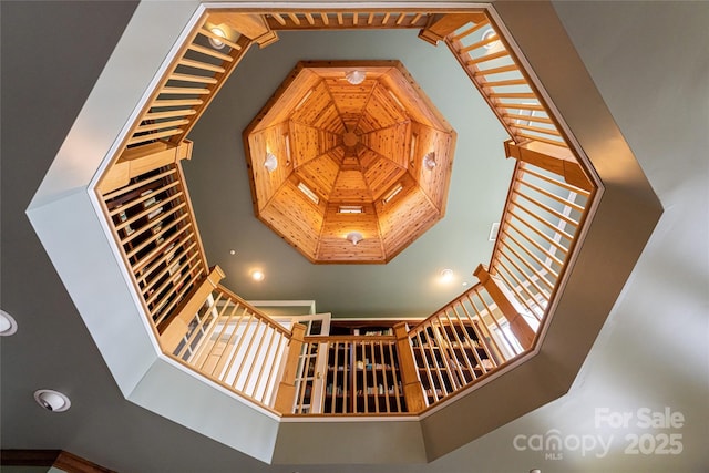 staircase with a high ceiling