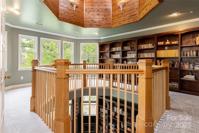 interior space featuring crown molding and carpet floors