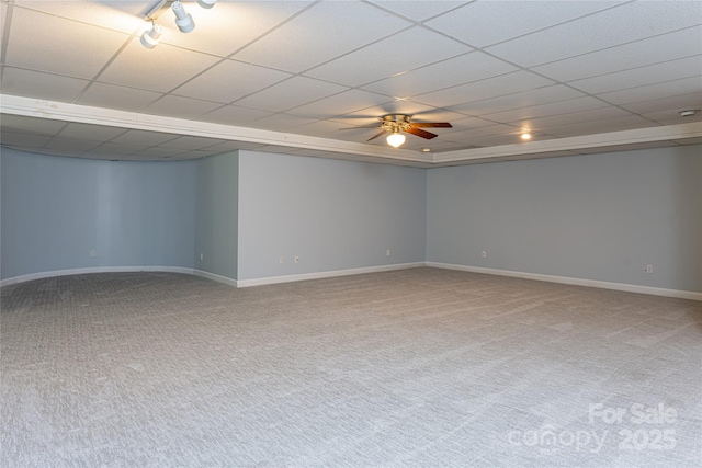 basement featuring carpet floors, a paneled ceiling, and ceiling fan