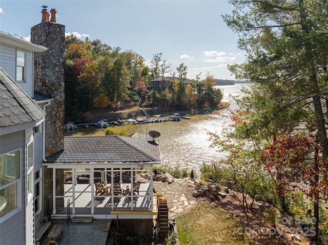 view of yard featuring a deck with water view