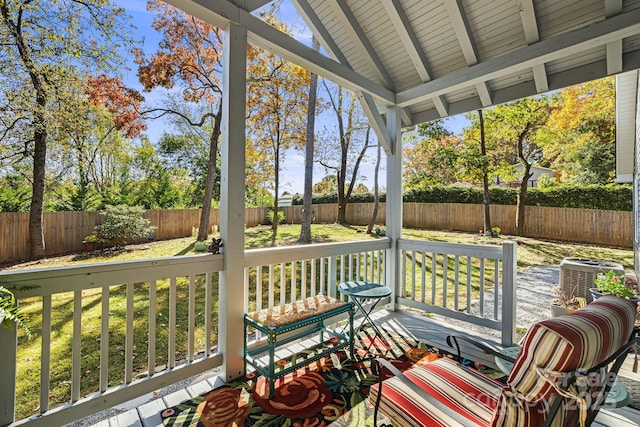 unfurnished sunroom with lofted ceiling with beams and a healthy amount of sunlight