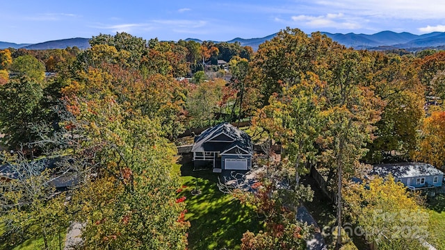 birds eye view of property featuring a mountain view