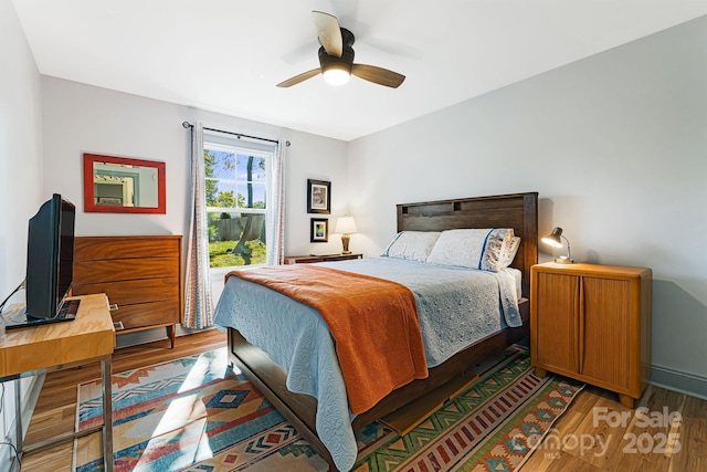 bedroom featuring hardwood / wood-style flooring and ceiling fan