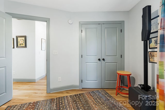 interior space with a closet and light wood-type flooring