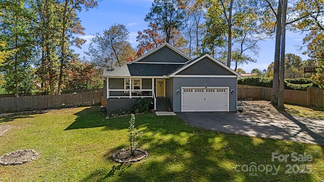 view of front facade featuring a garage and a front lawn