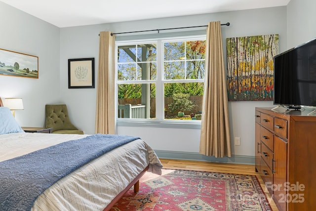 bedroom with wood-type flooring