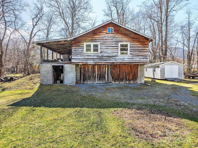 4 Badd Ln, Maggie Valley, NC 28751 - view of front of home with a shed, an outdoor structure, and a front lawn