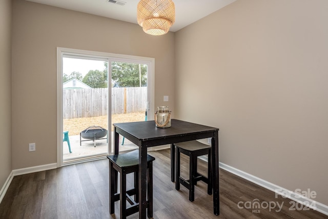 dining room with dark wood-type flooring