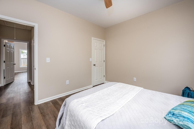 bedroom with dark wood-type flooring and ceiling fan