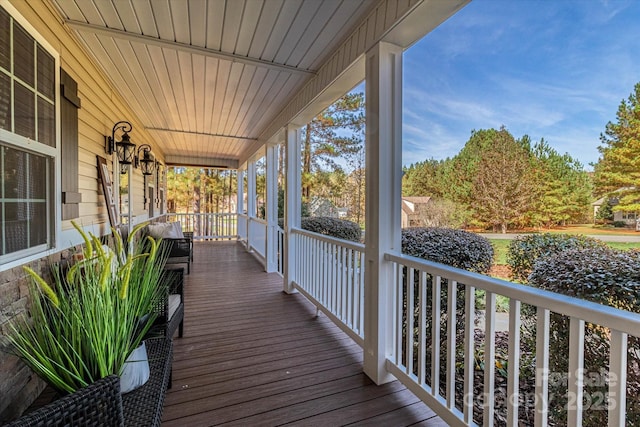 wooden deck featuring covered porch