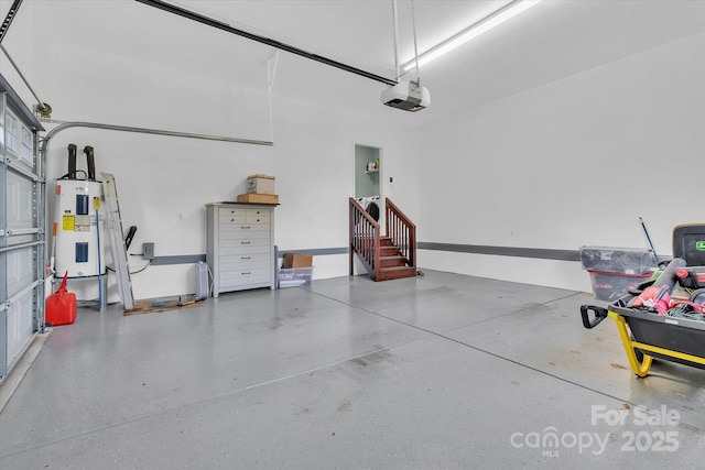 garage featuring water heater and a garage door opener