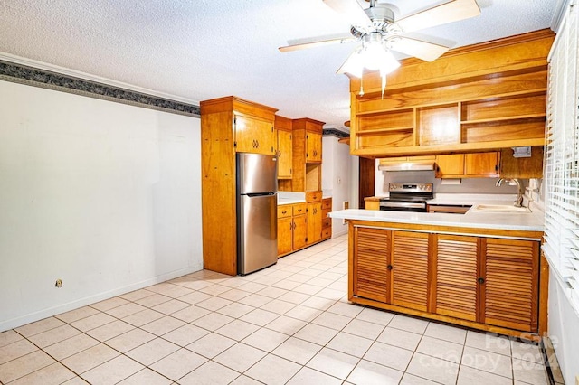 kitchen featuring appliances with stainless steel finishes, sink, kitchen peninsula, ceiling fan, and light tile patterned floors