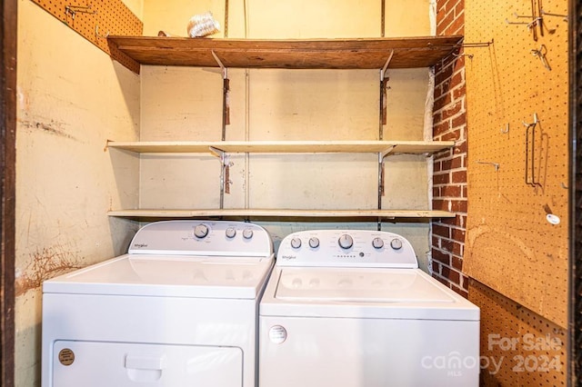 clothes washing area featuring washing machine and clothes dryer