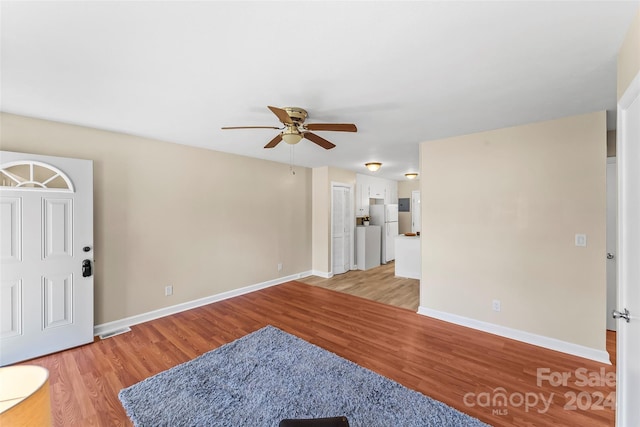 interior space with ceiling fan and light hardwood / wood-style flooring