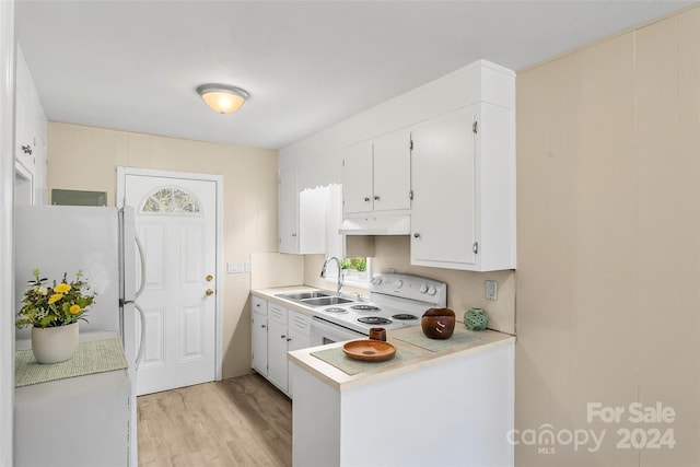 kitchen with white cabinetry, light hardwood / wood-style flooring, sink, and white appliances