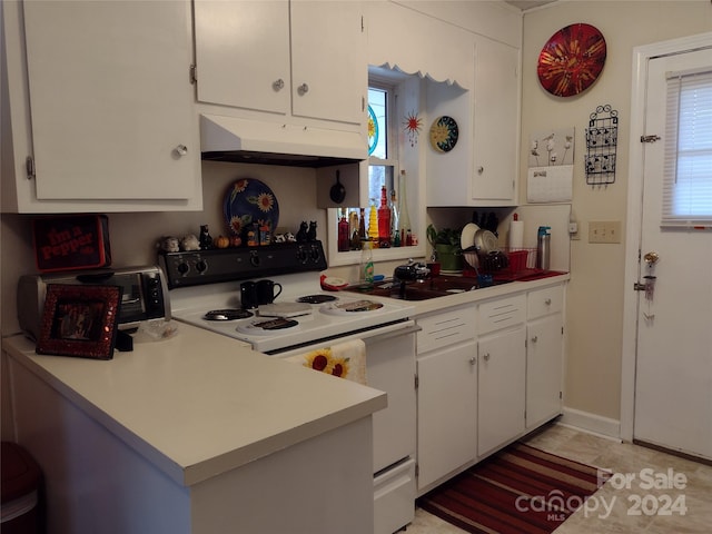 kitchen featuring white cabinets, sink, and white electric range oven