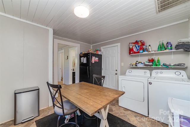 laundry area with ornamental molding and independent washer and dryer