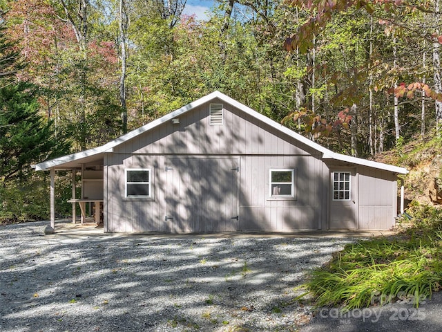 view of side of home with a garage