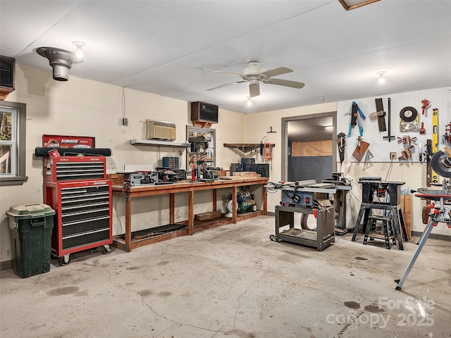 garage featuring a workshop area and ceiling fan