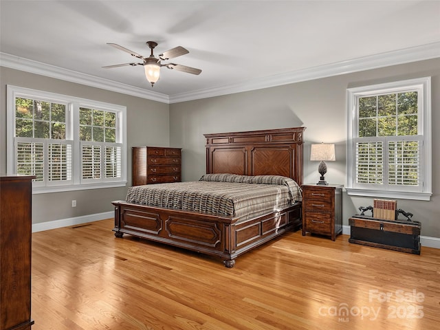 bedroom featuring crown molding, ceiling fan, and light hardwood / wood-style floors