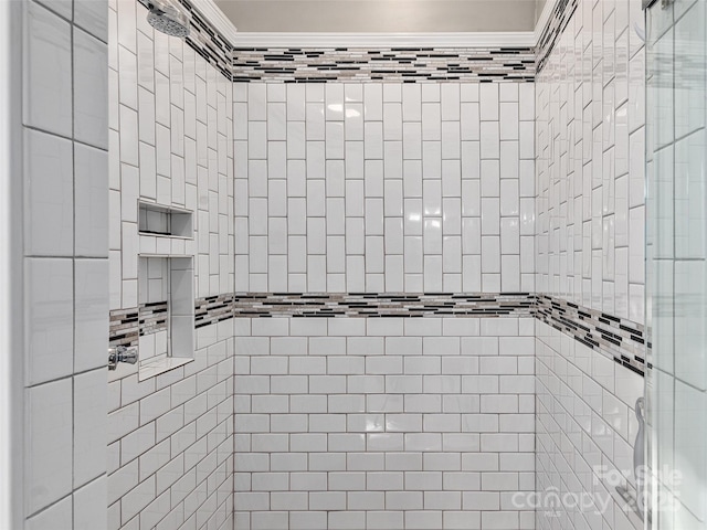 room details with a stall shower and ornamental molding