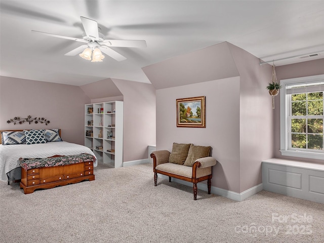 carpeted bedroom with vaulted ceiling and ceiling fan