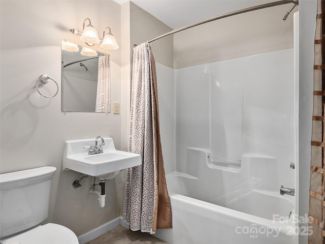 full bath featuring tile patterned flooring, shower / bath combination with curtain, and toilet