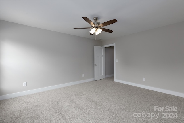 carpeted empty room with ceiling fan