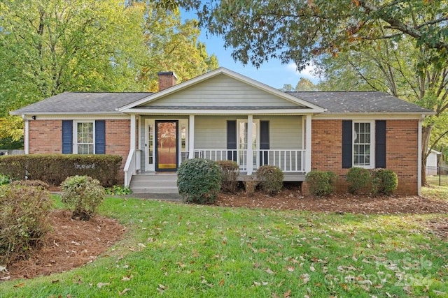 ranch-style house with a porch and a front yard