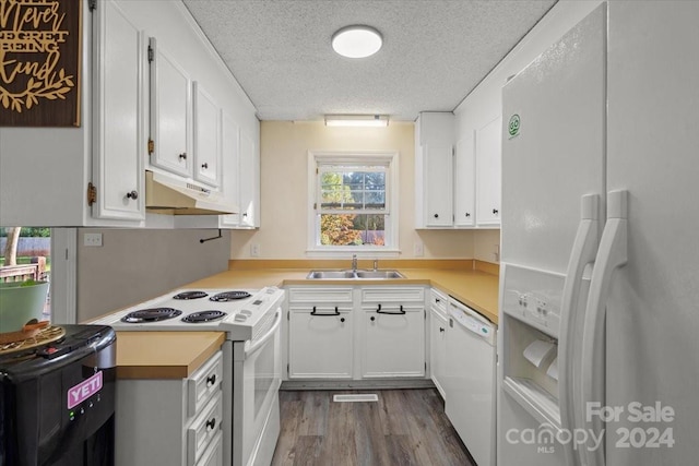 kitchen with a textured ceiling, white appliances, sink, white cabinets, and dark hardwood / wood-style floors