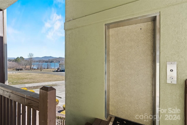 exterior space with a mountain view and elevator