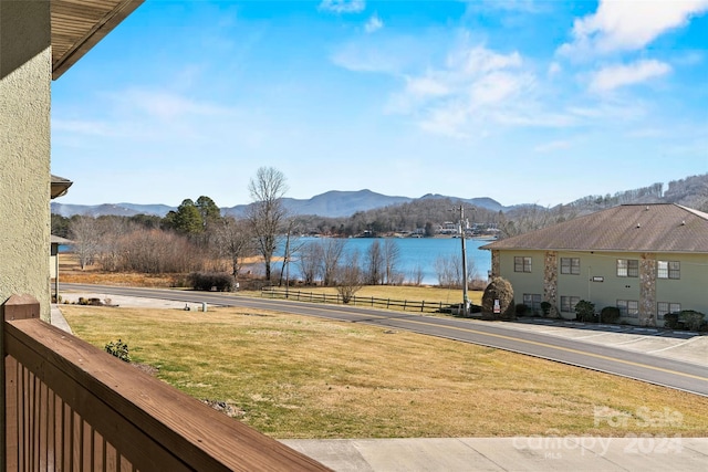 view of yard featuring a water and mountain view