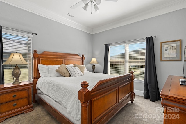 bedroom featuring crown molding, carpet flooring, and ceiling fan