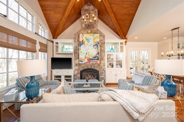 living room with a fireplace, wood-type flooring, wood ceiling, and ornamental molding