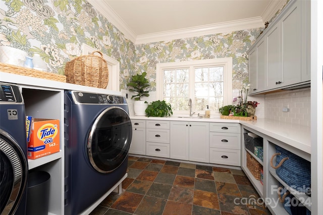 washroom with cabinets, crown molding, sink, and washer / clothes dryer